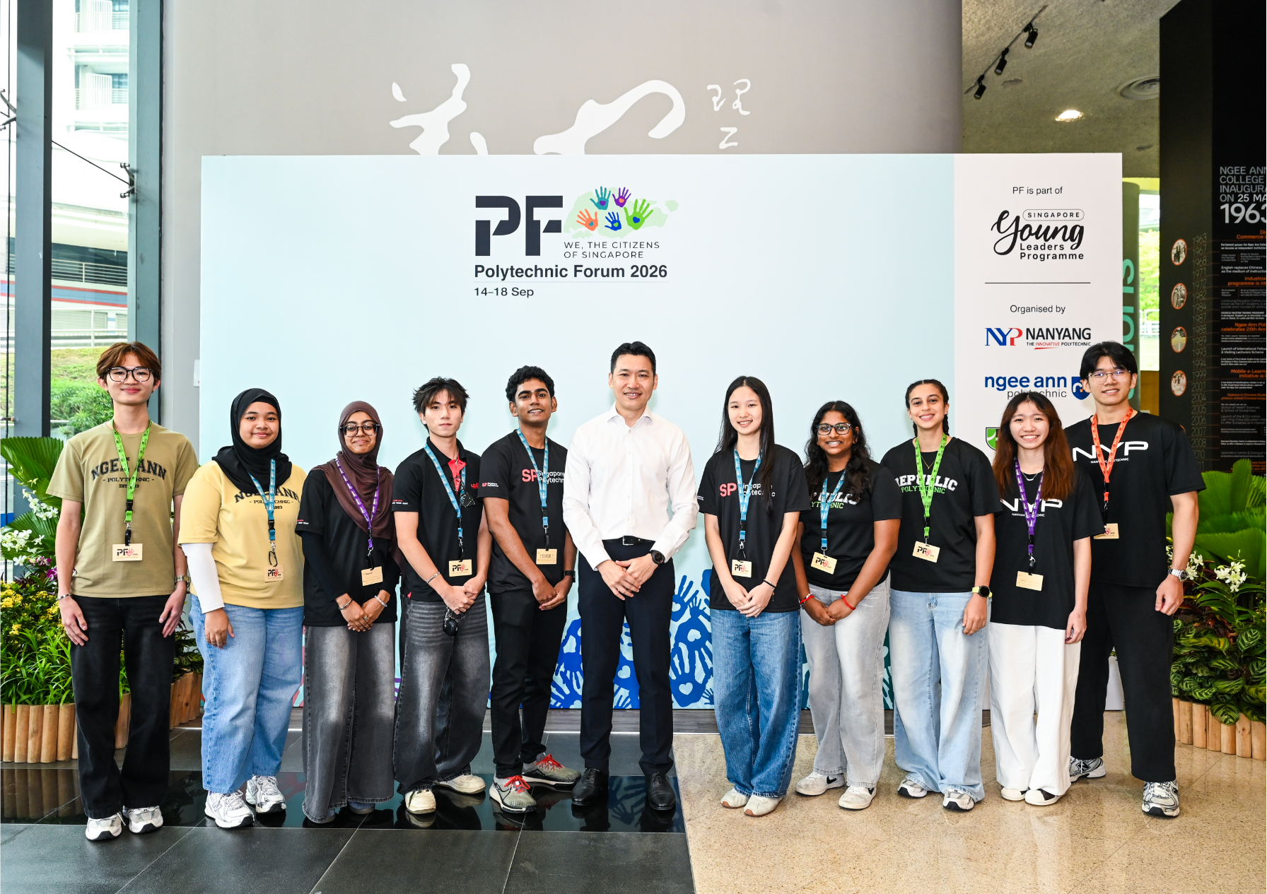 Selected student delegates taking a group photo with Minister David Neo.